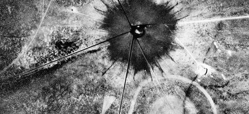 This is an aerial view of the aftermath of the first atomic explosion at Trinity Test Site, New Mexico, July 16, 1945.
