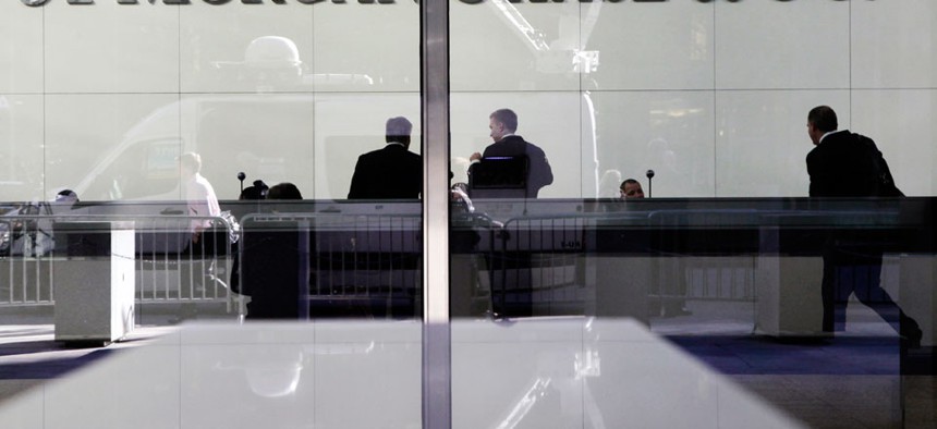 People stand in the lobby of JPMorgan's headquarters in New York.