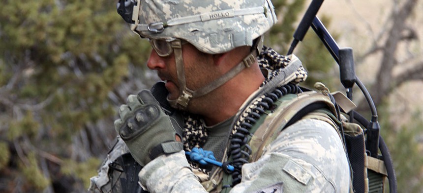 A Soldier from 2nd Brigade, 1st Armored Division, uses a Joint Tactical Radio System's Handheld, Manpack and Small Form Fit.