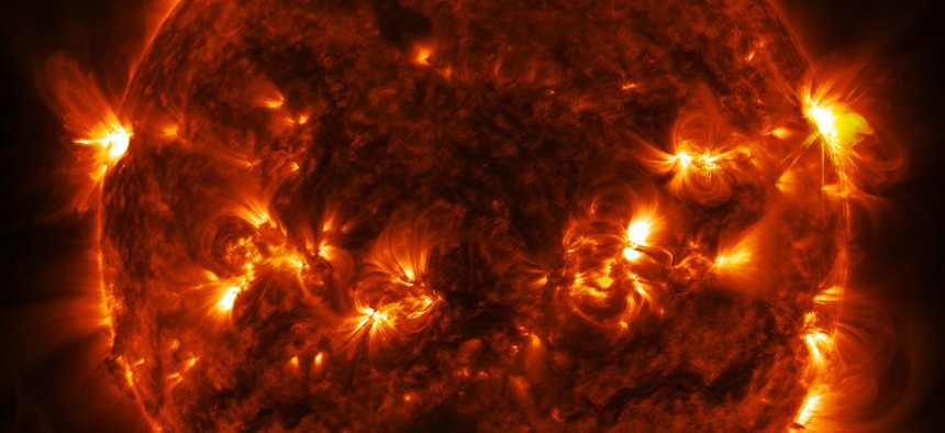 A solar flare erupts on the far right side of the sun, in this image captured by NASA's Solar Dynamics Observatory.