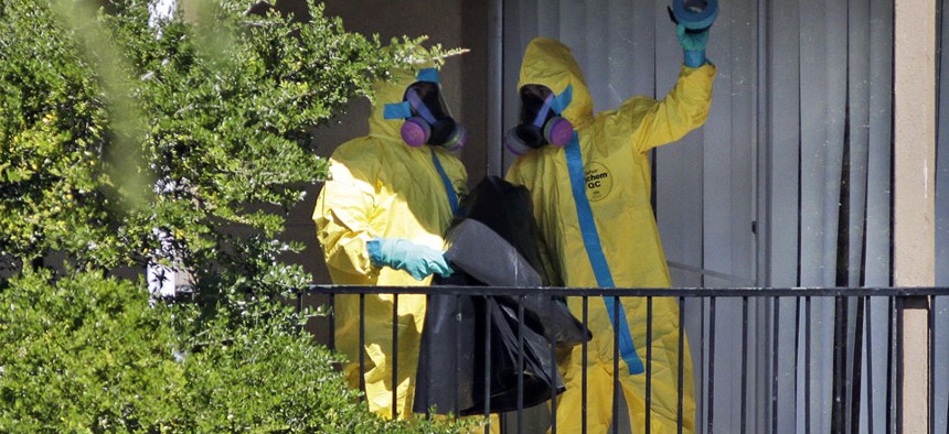 Hazardous material cleaners arrives at the apartment complex in Dallas, Friday, Oct. 3, 2014, where Thomas Eric Duncan, the Ebola patient who traveled from Liberia to Dallas stayed last week.