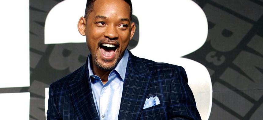 Actor Will Smith poses upon his arrival for a press conference to promote his new movie "Men in Black III".