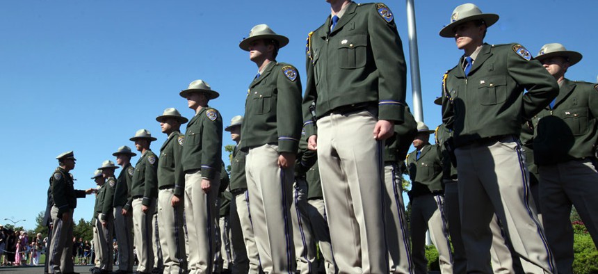 California Highway Patrol Academy cadets stand at attention during graduation ceremonies.