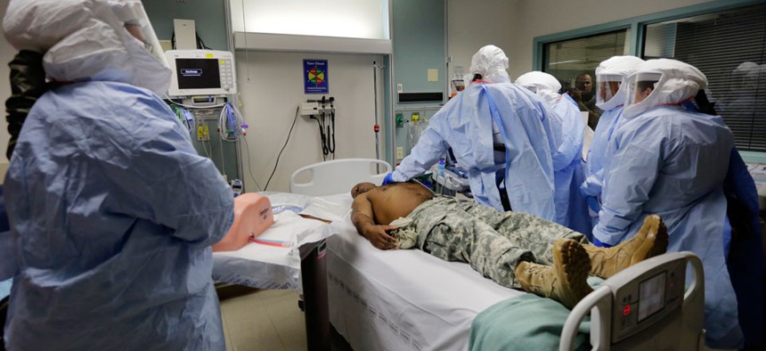 Members of the Department of Defense's Ebola Military Medical Support Team go through special training at San Antonio Military Medical Center.