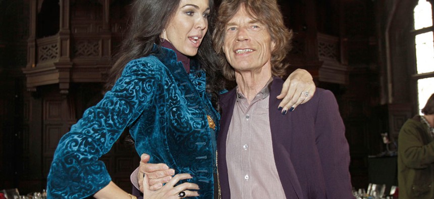 Singer Mick Jagger, right, with his girlfriend, designer L'Wren Scott.