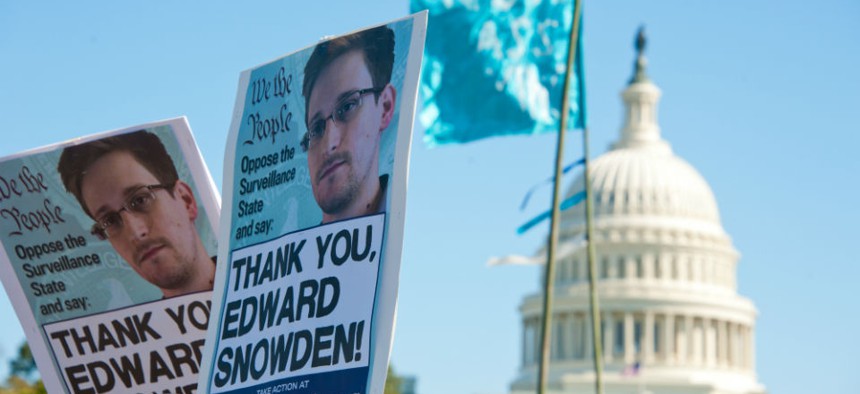 Signs held by protesters during a rally against mass surveillance in Washington, D.C., on October 26, 2013.
