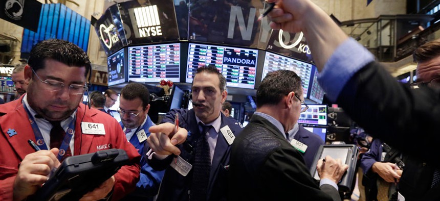 Traders work on the floor of the New York Stock Exchange Wednesday, Oct. 29, 2014. 