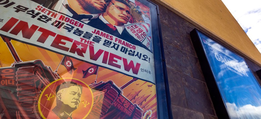 A movie poster for the movie "The Interview" is displayed outside the AMC Glendora 12 movie theater Wednesday, Dec. 17, 2014, in Glendora, Calif. 