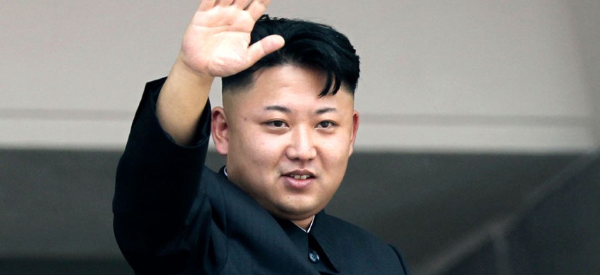 North Korean leader Kim Jong Un waves to spectators and participants of a mass military parade celebrating the 60th anniversary of the Korean War armistice in Pyongyang, North Korea.