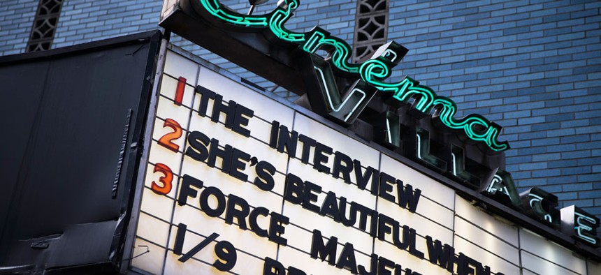 "The Interview" is listed on the Cinema Village movie theater marquee, Thursday, Dec. 25, 2014, in New York.