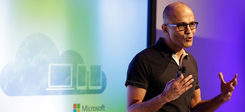 Microsoft CEO Satya Nadella gestures while speaking during a press briefing on the intersection of cloud and mobile computing.