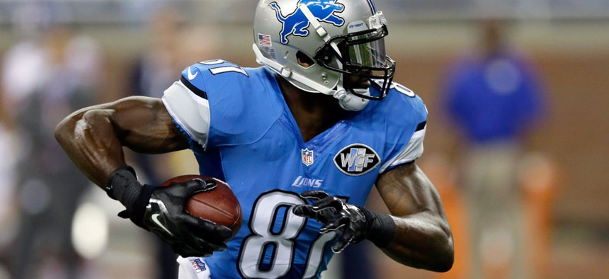 Detroit Lions wide receiver Calvin Johnson runs for a 67-yard touchdown reception during the first quarter of an NFL football game against the New York Giants in Detroit. Johnson is one of the most traded players in CBS Sports and Yahoo fantasy leagues.