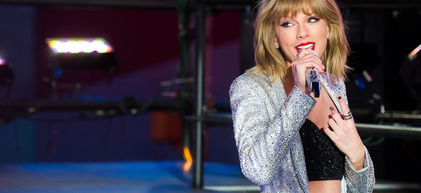 Taylor Swift performs in Times Square during New Year's Eve celebrations.