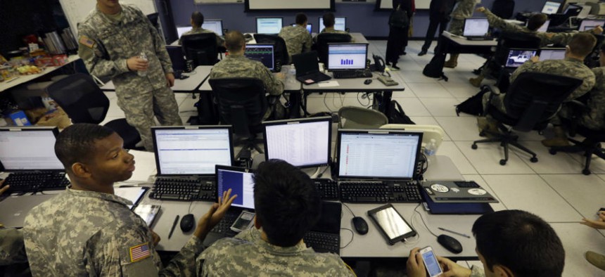 United States Military Academy cadets watch data on computers at the Cyber Research Center at the United States Military Academy in West Point, N.Y., Wednesday, April 9, 2014. The West Point cadets are fending off cyber attacks this week as part of an exe