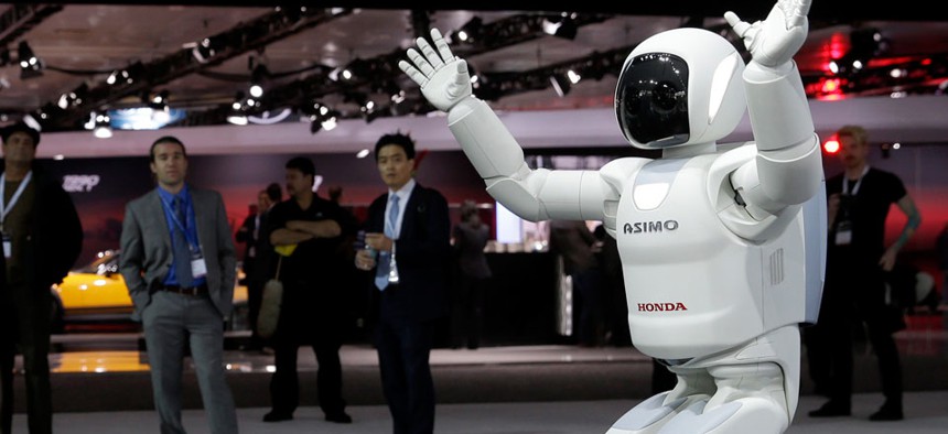 The Asimo Robot made by Honda is displayed at the New York International Auto Show.