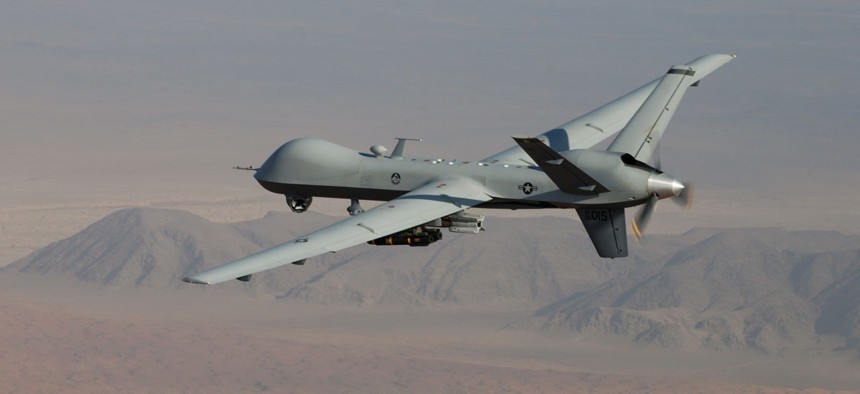 An MQ-9 Reaper, armed with GBU-12 Paveway II laser guided munitions and AGM-114 Hellfire missiles, piloted by Col. Lex Turner flies a combat mission over southern Afghanistan.