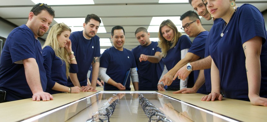 Apple Team Members prepare for the release of the Apple Watch at the Eaton Centre Apple Store on Friday, April 10, 2015 in Toronto. 