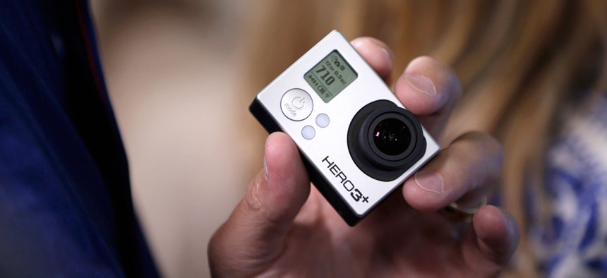 A GoPro camera is held during the GoPro IPO at the Nasdaq MarketSite in New York