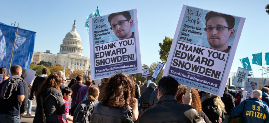 Demonstrators rally at the U.S. Capitol to protest spying on Americans by the National Security Agency