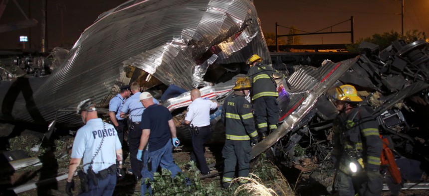 Emergency personnel work at the scene of the Amtrak train wreck, Tuesday, May 12, 2015, in Philadelphia. 