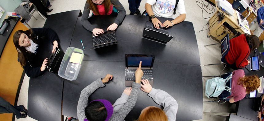 Students at Pacific Middle School in Des Moines, Wash., take part in the international Hour of Code project, Tuesday, Dec. 9, 2014. 