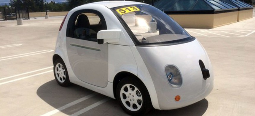 Google's latest prototype waits to give rides on the roof of the Google-X building. 