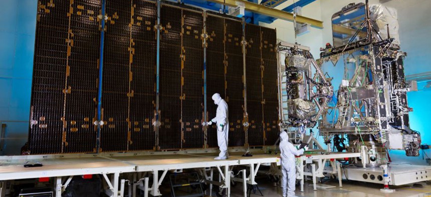 The fully-integrated GOES-R satellite is shown in a clean room at a Lockheed Martin facility in Littleton, Colorado.