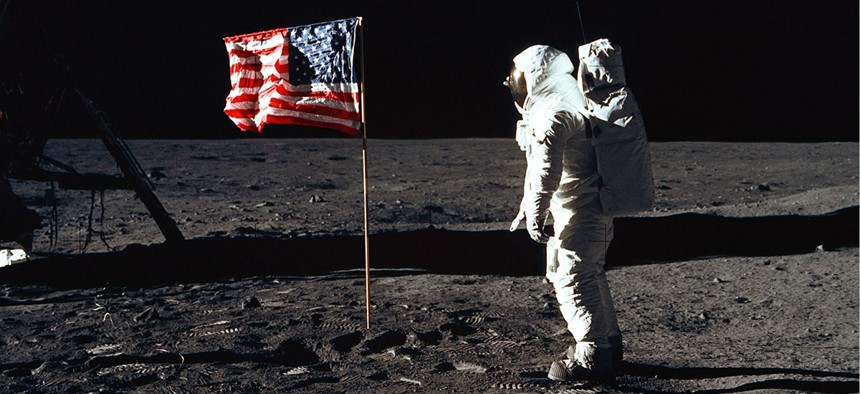 Astronaut Buzz Aldrin, lunar module pilot of the first lunar landing mission, poses for a photograph beside the deployed United States flag during an Apollo 11 Extravehicular Activity (EVA) on the lunar surface. 