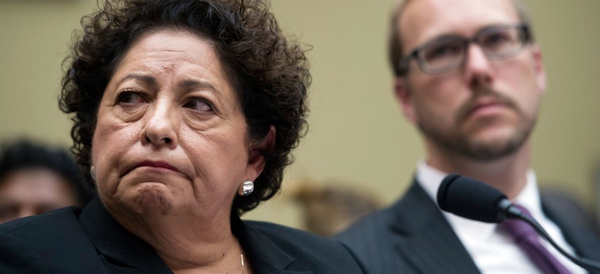 OPM Director Katherine Archuleta, left, and Dr. Andy Ozment, assistant secretary, Office of Cybersecurity and Communications, National Program Preparedness Directorate, Homeland Security Department, testify on Capitol Hill.