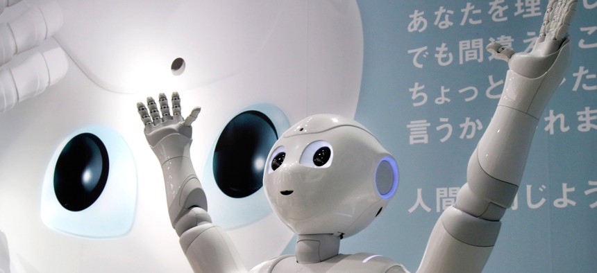 Humanoid Robot "Pepper" is displayed at SoftBank Mobile shop in Tokyo, Friday, June 6, 2014.