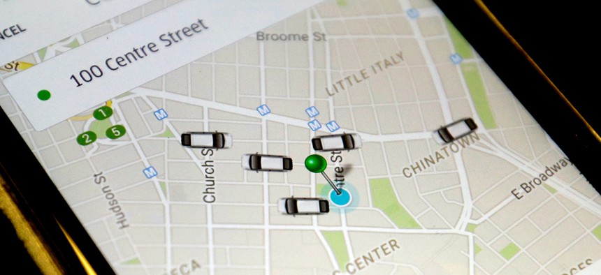 The Uber app displays cars available to make a pickup in downtown Manhattan on a smart phone, in New York.