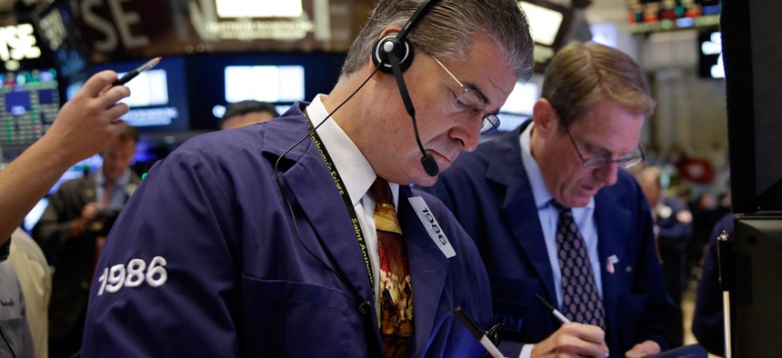 Trader Daniel Kryger works on the floor of the New York Stock Exchange, Thursday, July 9, 2015 in New York.