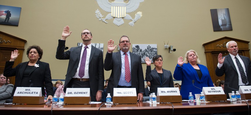 Third from left, Sylvia Burns, Interior CIO, testifies before the House Oversight and Government Reform committee's hearing on the Office of Personnel Management data breach.