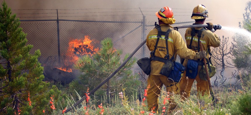 Los Angeles County firefighters fight a fire near Wrightwood, Calif.