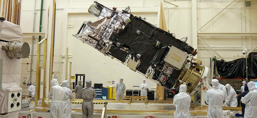 The fully-integrated GOES-R satellite is shown in a clean room at a Lockheed Martin facility in Littleton, Colorado. 