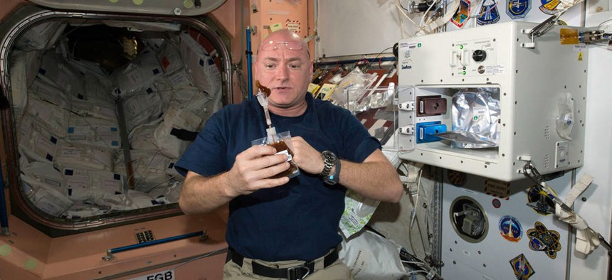 NASA astronaut Scott Kelly enjoys his first drink from the new ISSpresso machine.