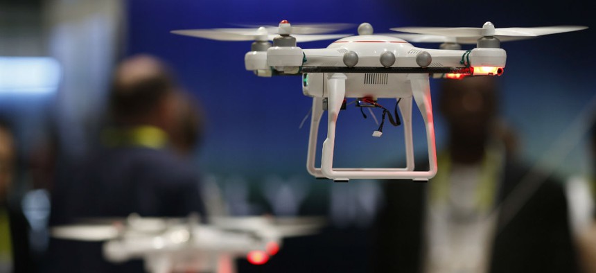 Drones fly at the Autel booth during the International CES Wednesday, Jan. 7, 2015, in Las Vegas.