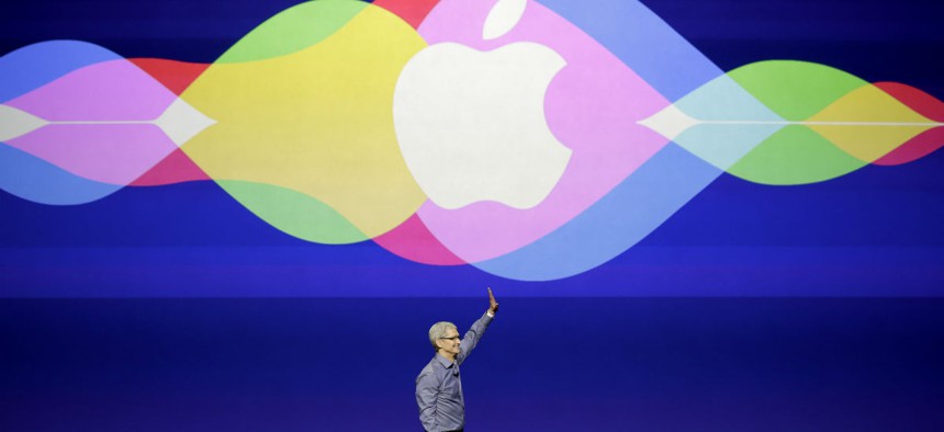 Apple CEO Tim Cook waves during the Apple event in San Francisco, Wednesday, Sept. 9, 2015.