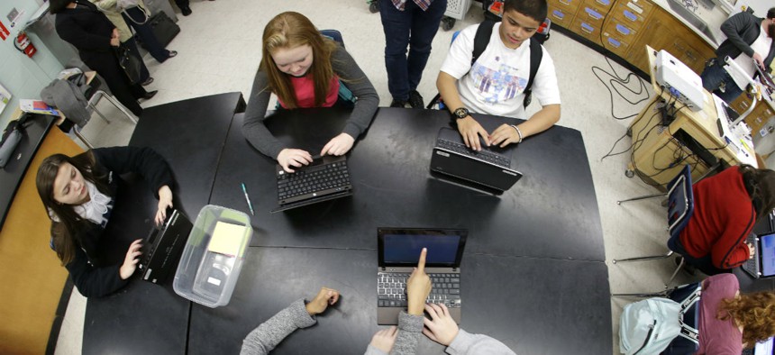 Students at Pacific Middle School in Des Moines, Wash., take part in the international Hour of Code project, Tuesday, Dec. 9, 2014.