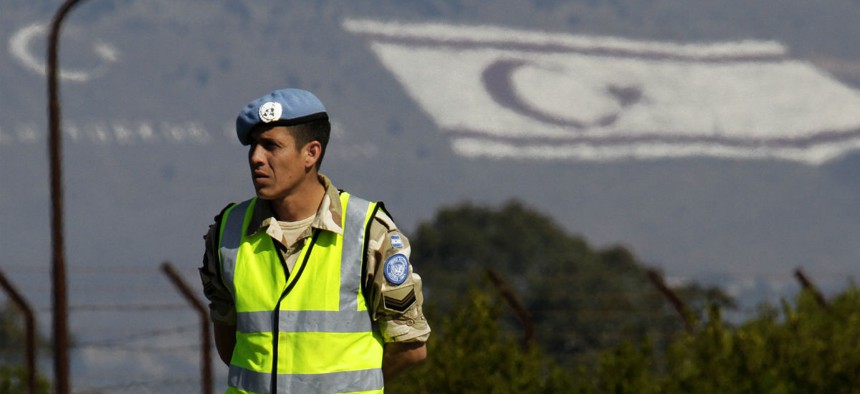 An Argentinean UN peacekeeper stands guard in northern Cyprus.