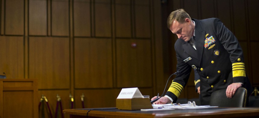 Director of the NSA, Adm. Michael Rogers takes notes on Capitol Hill, Thursday, Sept. 24, 2015