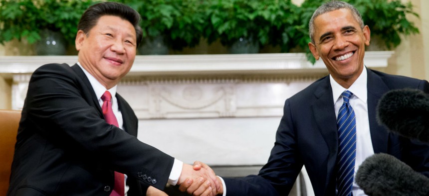 President Barack Obama shakes hands with Chinese President Xi Jinping during their meeting in the Oval Office of the White House.