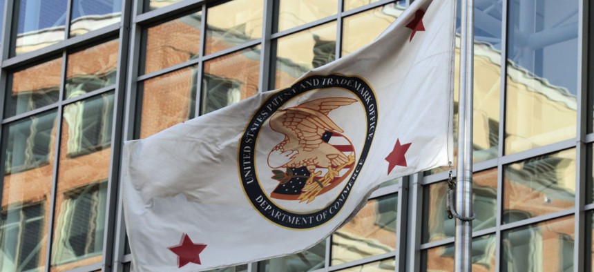 The flag for the U.S. Patent and Trademark Office is seen outside the agency's headquarters in Alexandria, Va.
