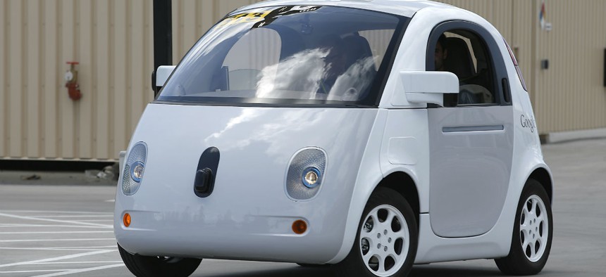 Google's new self-driving prototype car drives around a parking lot during a demonstration at the Google campus.