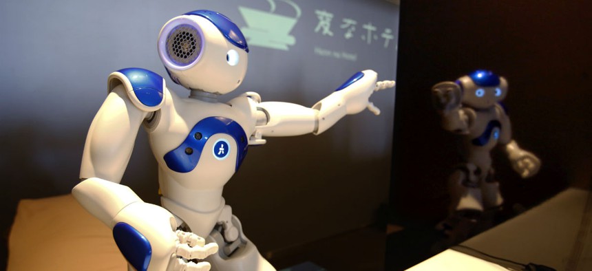 A receptionist robot performs during a demonstration for the media at a new hotel in Japan.