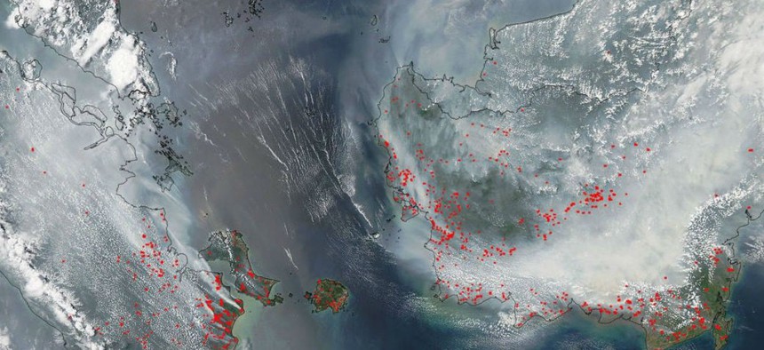 That's Borneo on the right, under all that smoke. Sumatra is on the left.