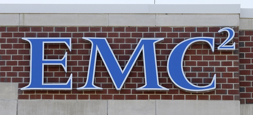 An EMC logo is attached to a building on the company's corporate campus, Monday, Oct. 12, 2015, in Hopkinton, Mass. Dell is buying data storage company EMC in a deal valued at approximately $67 billion. 