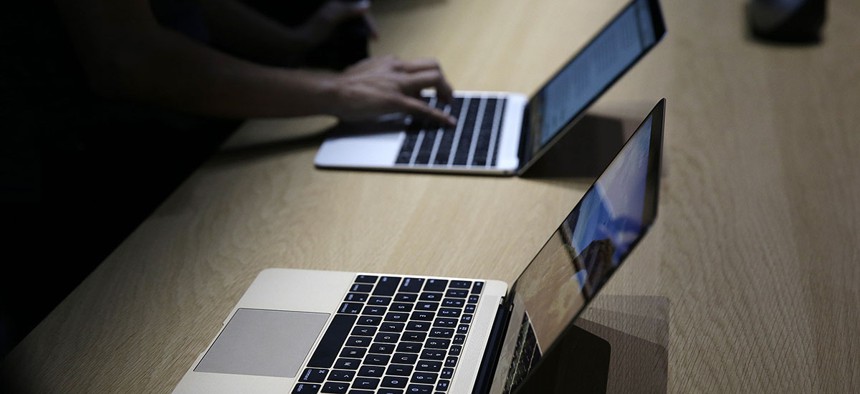 The new two-pound MacBook is on display in a demo room following an Apple event Monday, March 9, 2015.