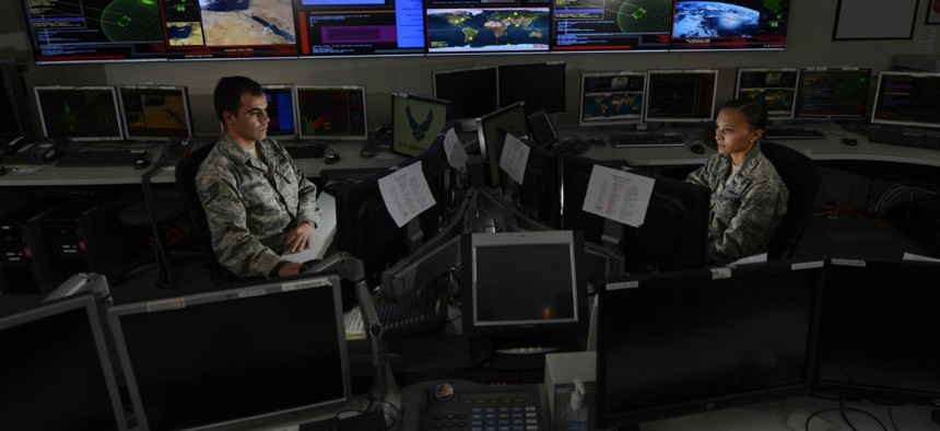 Staff Sgt. Alex Garviria, 721st Communication Squadron senior systems controller, and 2nd Lt. Rachel James, 721st CS crew commander, work in the Global Strategic Warning and Space Surveillance System Center at Cheyenne Mountain Air Force Station, Colo., S