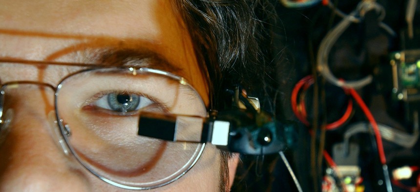 In this 2003 photo, Richard W. DeVaul, a MIT graduate student, wears a tiny computer display mounted on eyeglass frames at the MIT Media Lab.